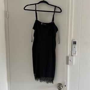 Volcom bodycon dress vintage with lace trim and bra like straps. LBD